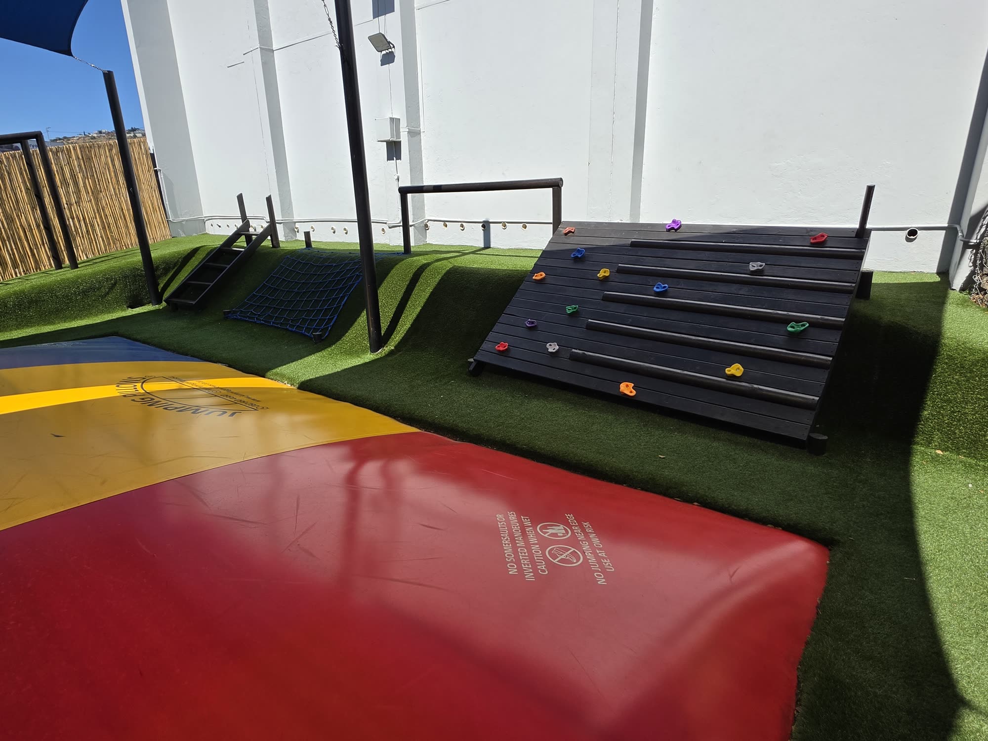 Climbing wall and trampoline